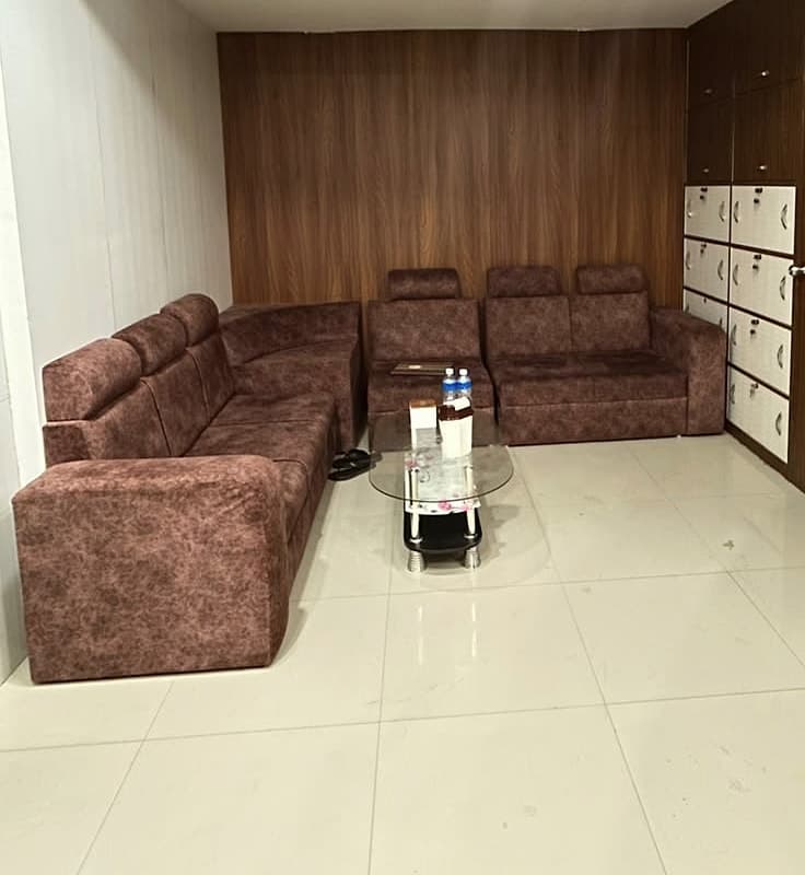 The waiting lounge, with corner seating and lockers for belongings
